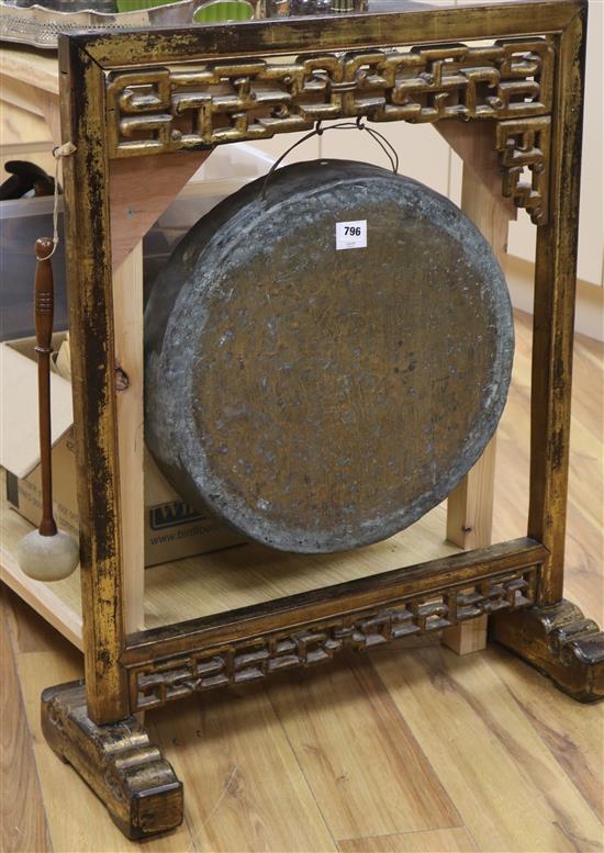 A Chinese gong on stand with a beater, H.90cm